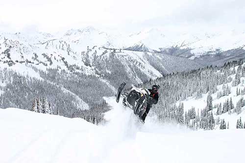 snowmobile tuning service on the hill, in the field